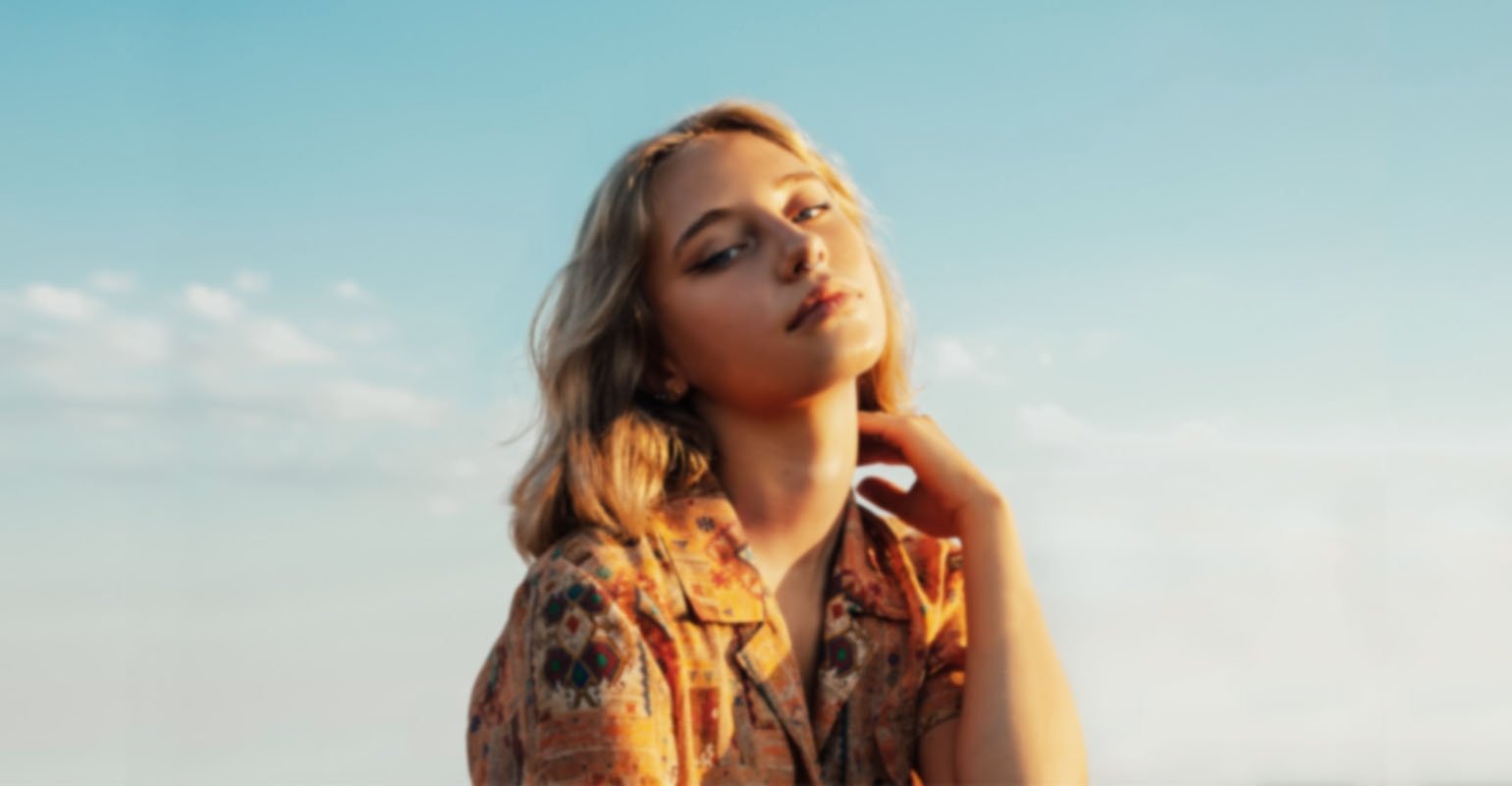 A blurry close-up photo of a woman