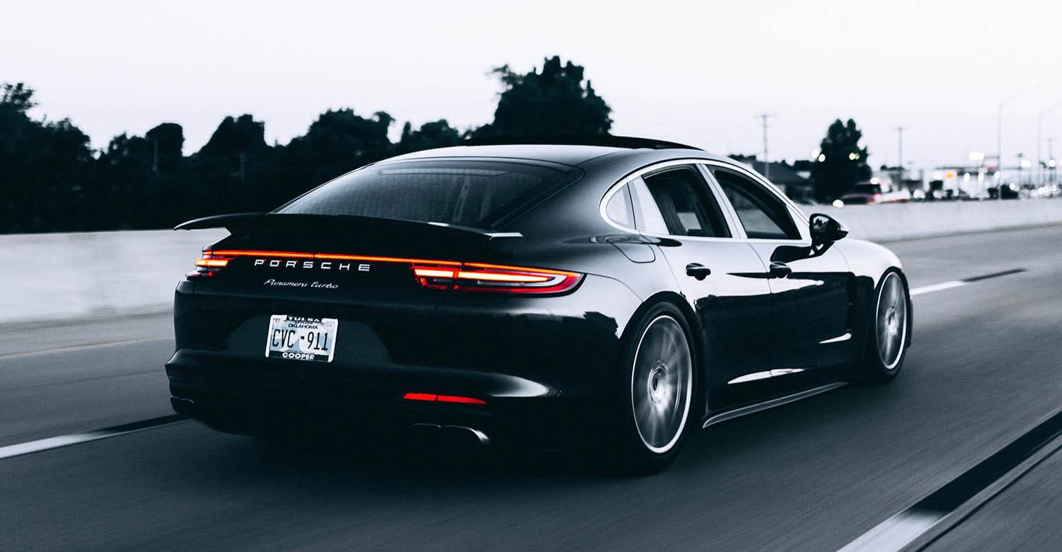 Photo of a running black car
